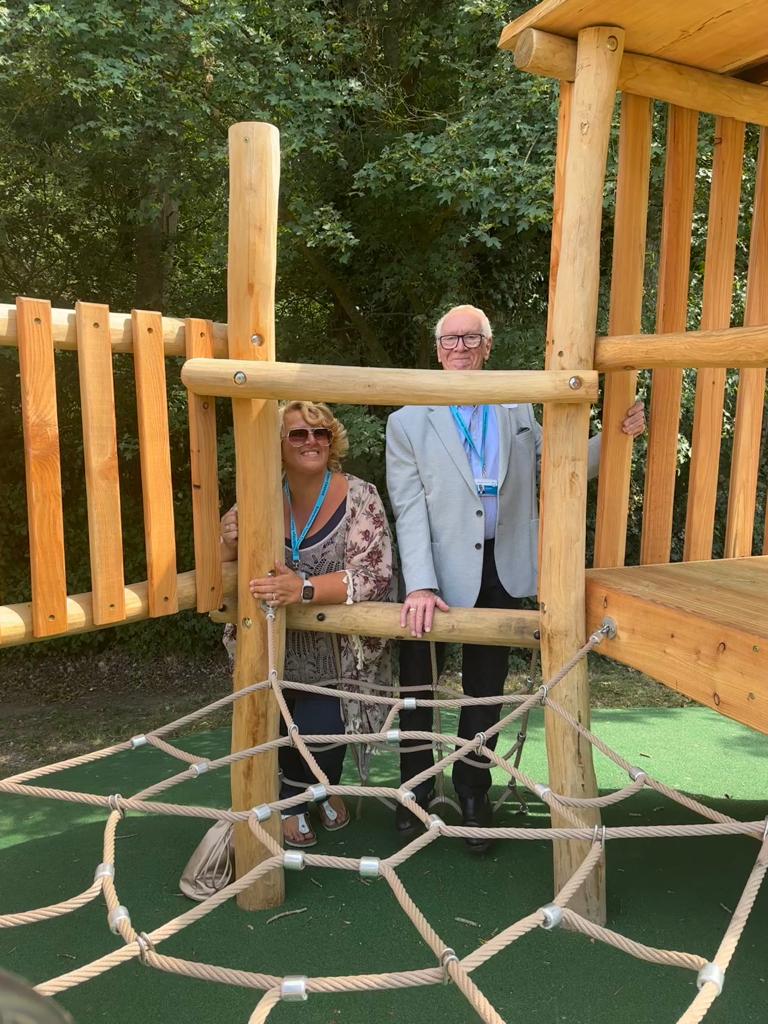 Two councillors at children's play area