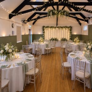 An AI-generated image of a hall room set up with tables and chairs and flowers with white decor for a wedding